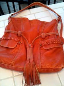 brown leather purse with tassels